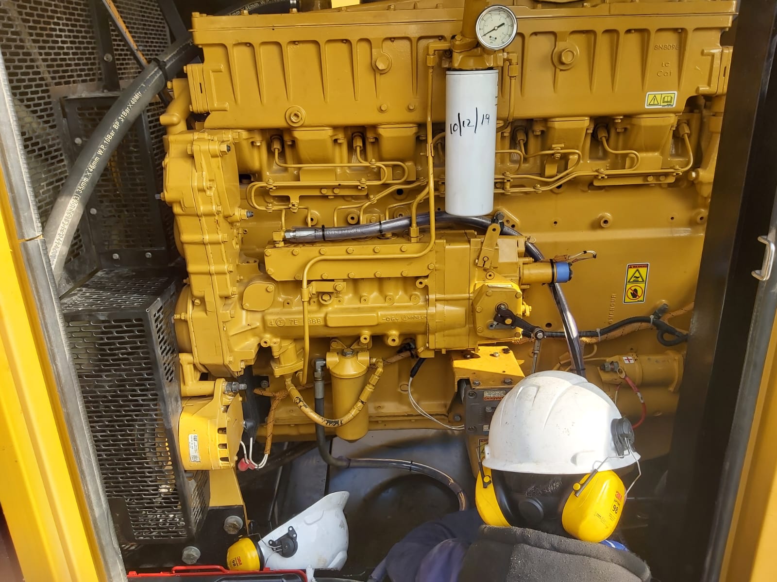 Engineers maintaining power equipment